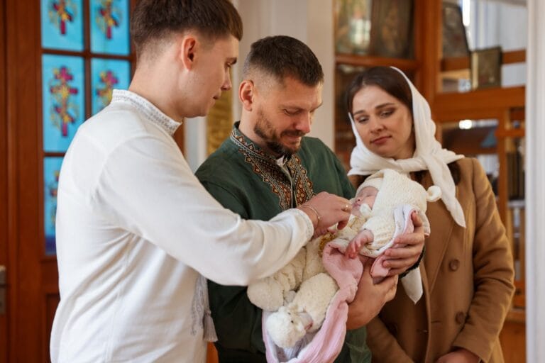People with Child during Baptism Ceremony in Church